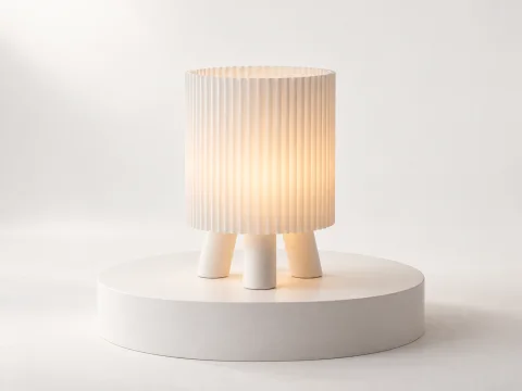 Custom Lumhaus lamp on a white studio pedestal